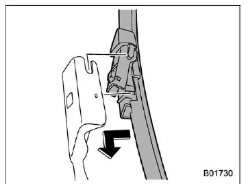 Subaru Ascent installing new windshield wiper blade assembly onto arm