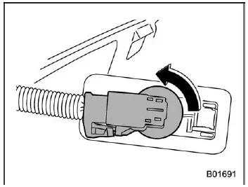 Subaru Ascent removing license plate light bulb socket by turning counterclockwise