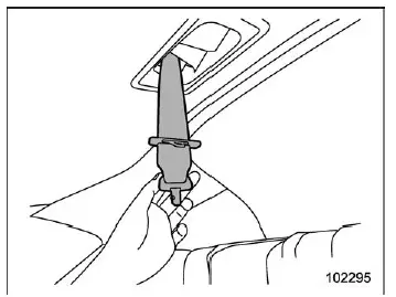 Subaru Ascent pulling anchor tongue plate from ceiling storage