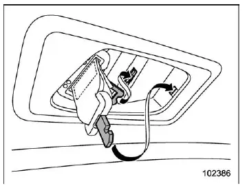 Subaru Ascent guiding seatbelt back into overhead retractor